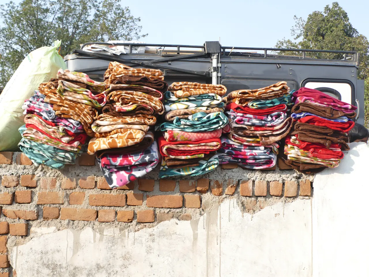 Stacks of donated blankets ready for a winter distribution drive