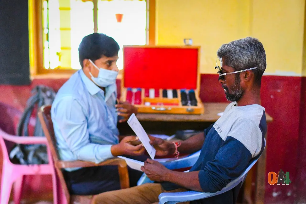 An OAI volunteer doctor examining a patient at a rural medical camp