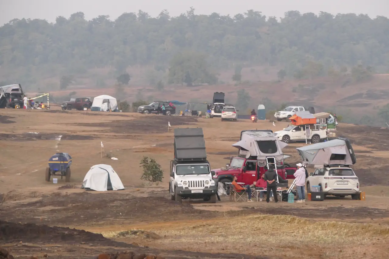 A chapter camp with rooftop tents popped up at sunset