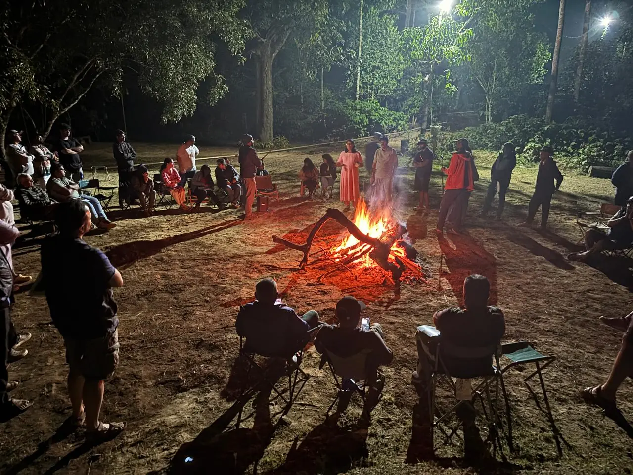 OAI members gathered around the closing bonfire in Kushalnagar